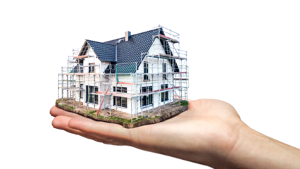 Hand holding a scale model of a single family house under construction