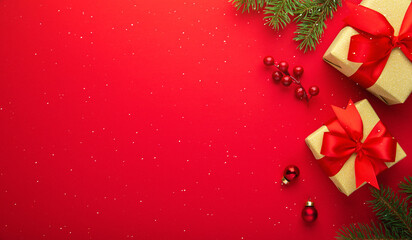 Merry Christmas and Happy Holidays greeting card, frame, banner. New Year. Golden, red Christmas decoration and gifts, presents on red background top view. Winter xmas festive holiday theme.