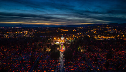 Aerial view of Mirogoj Cemetery illuminated with countless candles under the twilight sky, creating a poignant spectacle of light and remembrance, Zagreb, Zagreb, Croatia.