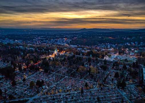 Aerial view of Mirogoj Cemetery's solemn rows of graves beneath a twilight sky, Zagreb, Zagreb, Croatia.