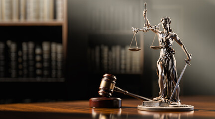 Legal Concept: Themis is the goddess of justice and the judge's gavel hammer as a symbol of law and order on the background of books