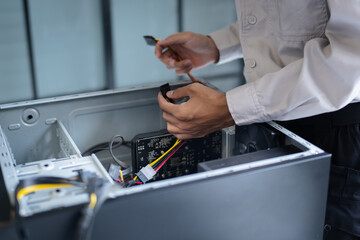 technician troubleshoots PC hardware issues in a technical engineering lab