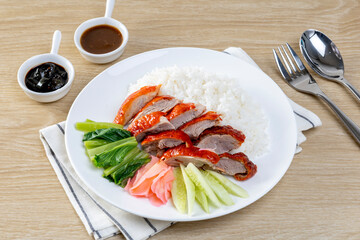 Barbecue roasted duck on rice  on the wooden table
