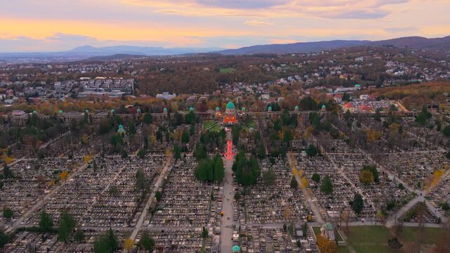 Aerial view of Mirogoj Cemetery's domes and architecture amidst rows of tombstones, blending with the surrounding landscape, Mirogoj Cemetery, Grad Zagreb, Croatia.