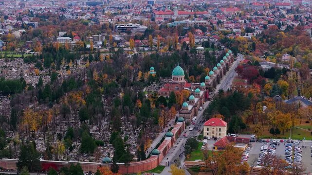 Aerial view of the Mirogoj Cemetery with its impressive architecture and rows of tombs surrounded by trees in autumn colors, Mirogoj Cemetery, Grad Zagreb, Croatia.