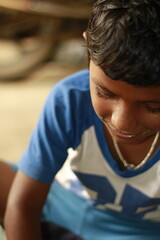 Close-up view of a young child eating homemade food, with small bits of food around the mouth,  innocence of childhood mealtime and the emotional bond of being lovingly fed by a caring hand.