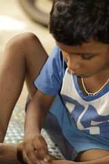 Close-up view of a young child eating homemade food, with small bits of food around the mouth,  innocence of childhood mealtime and the emotional bond of being lovingly fed by a caring hand.