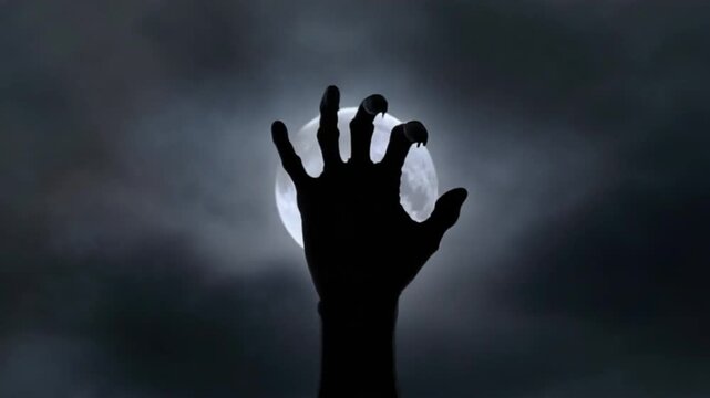 zombie hand grasping the moon