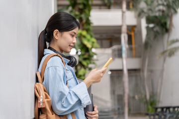 Portrait beautiful Asian woman student. Smile girl happy study. Use phone read ebook in college campus. young female on international Asia University. Education, study, school, learning, exam