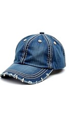 Fototapeta premium A blue denim cap with faded color, visible stitches, and small fabric tears, isolated on white background representing youthful spirit and timeless casual style. 