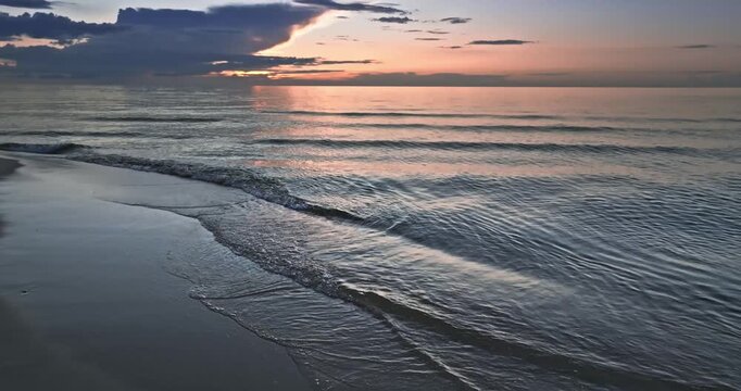 Calm golden sunset over Batlic sea in summer.