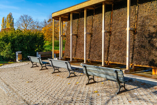 Saline graduation tower with benches in a park on a sunny autumn day, recreational outdoor inhalation area in a public space