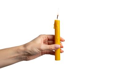 A hand holding a burning yellow candle. The flame is small and bright, and the candle is made of wax