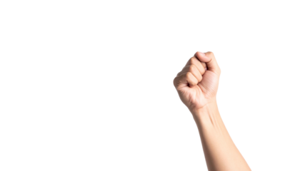 A hand held in a fist, symbolizing strength and determination. The arm is raised against the empty space 