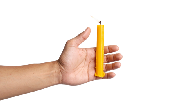 A hand holding a yellow candle with a burning flame. The candle is tall and slender, and the flame flickers gently