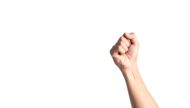 A hand held in a fist, symbolizing strength and determination. The arm is raised against the empty space 