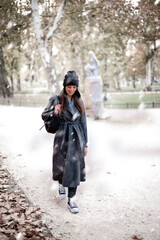 Woman enjoying the snow in the city park