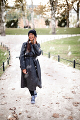 Woman enjoying the snow in the city park