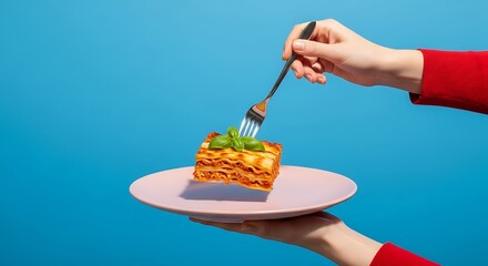 Delicious lasagna served with basil on a pink plate ready to eat