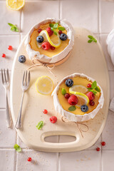 Tasty lemon curd with cottage cheese and berries.