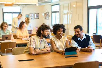 Diverse startup team collaborating in modern coworking office