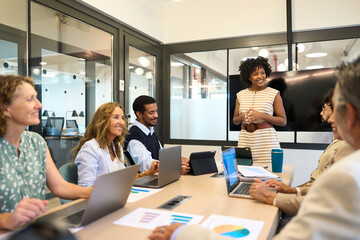 Obraz premium Diverse business team collaborating during office meeting presentation