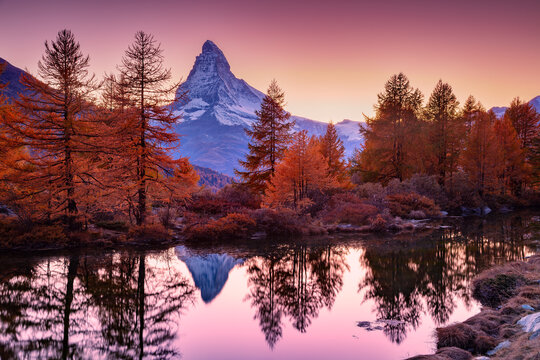 Matterhorn, Swiss Alps, Switzerland. Landscape image of Swiss Alps with Grindjisee and iconic peak Matterhorn in the background at beautiful autumn sunset.