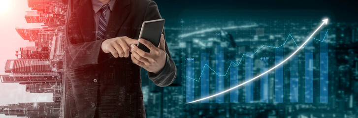 A businessman engages with a smartphone, analyzing financial graphs in a modern urban setting, emphasizing technology-driven market growth. Impute