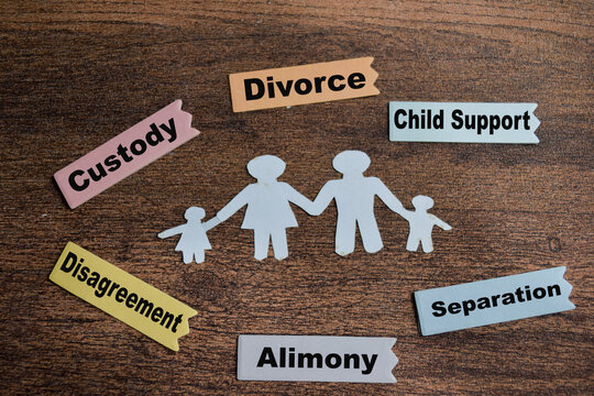 Concept of family breakup write on sticky notes isolated on Wooden Table.