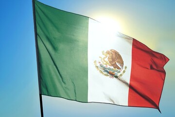 Mexico national flag waving in sunlight close-up – Mexican tricolor green white red banner with coat of arms eagle serpent cactus symbol patriotic background blue sky bright sunny day high resolution
