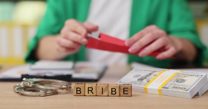 Examining consequences of corruption with hands-on demonstration of bribe exchange in an office setting