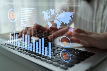 A close-up view of hands typing on a laptop keyboard, overlaid with vibrant data visualization...