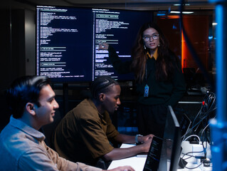 Female Software Developer Manager Leader presenting Coding Software development application Project, Briefing solution to Programmer Team in Co working Office Space. Tech and artificial intelligence.