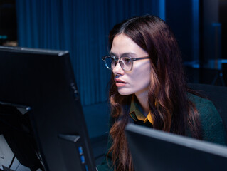 Close-up of Young Female computer programmer working on desktop computer, writing code, developing app, Ai prompt project sit at desk in tech company office. Professional Programmer Working on Coding.