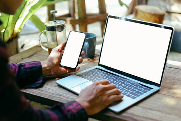 computer screen,mobile phone blank mockup.work using laptop texting mobile.white background for advertising,contact business search information on desk in cafe.marketing,design