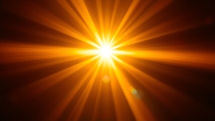 Dramatic golden light beams shining through darkness, creating an abstract bokeh effect.