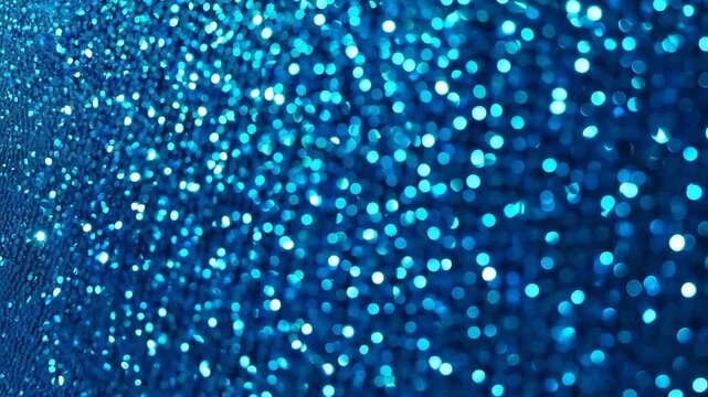 Abstract blue glitter background with bokeh effect and sparkling lights