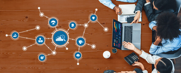 Panorama top view multiracial analyst team use BI dashboard display on laptop screen, analyzing financial data for strategic decision. Fintech analyzes marketing indicators. Concord Amity