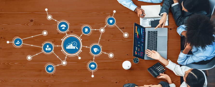 Panorama top view multiracial analyst team use BI dashboard display on laptop screen, analyzing financial data for strategic decision. Fintech analyzes marketing indicators. Concord Amity - Powered by Adobe