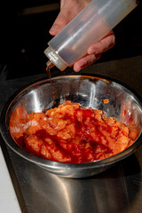 The process of making salmon tartare by a professional chef