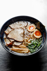 Ramen soup on a plain background isolated in backlight