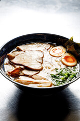 Ramen soup on a plain background isolated in backlight