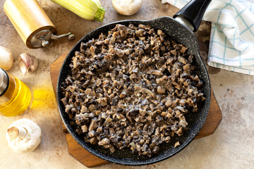 Step-by-step cooking recipe zucchini roll with mushroom filling.