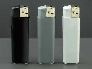 3 lighters black grey white