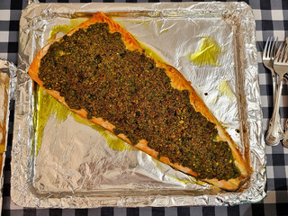 Lavash with liver filling baked on a baking sheet. Top view. Food.