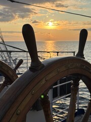 at the ancient ship's wheel at sunset