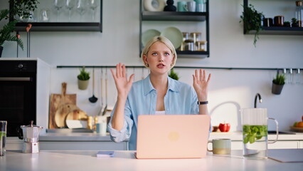 Business coach talking video meeting by laptop sitting home kitchen closeup
