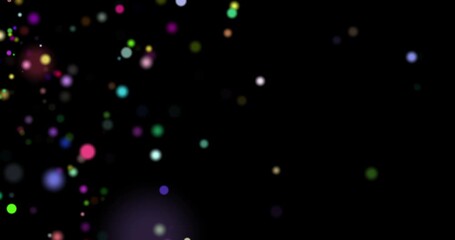 Colorful particles floating slowly over dark background, abstract magical multicolored stardust or confetti, footage - Powered by Adobe