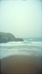 Vintage image of ocean waves reaching the beach with a motion effect