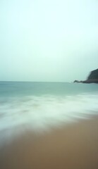 Vintage image of ocean waves reaching the beach with a motion effect